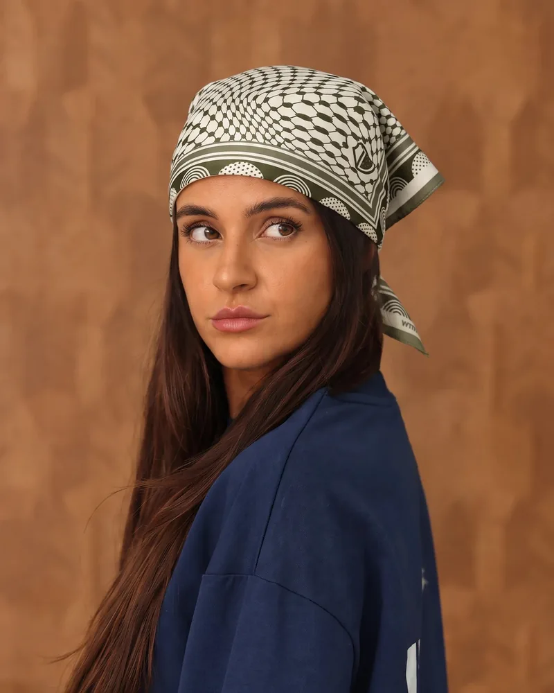 Roots silk bandana in green, worn as a headscarf